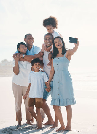 Selfie, beach and portrait of happy family on social media together at the sea or ocean for love, care and happiness. Internet, online and parents with children or kids and grandparents on a holidayの写真素材