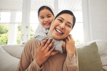 Portrait, hug and muslim mother, happy child or family bonding, laugh and enjoy quality time together. Living room sofa, happiness and face of Islamic mom, youth kid or Arabic people embrace at homeの写真素材