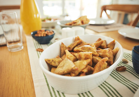 Food, Eid Mubarak and samosa for family at table for Islamic celebration, festival and lunch...