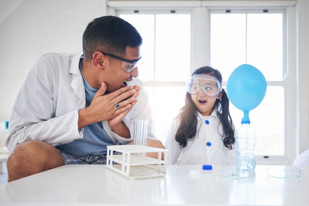 Wow, education and a father and child doing science, learning innovation and lab work in a house....