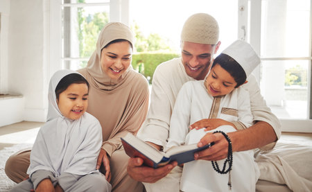 Happy family, Muslim parents or children reading book for learning, Islamic knowledge or studying in Allah or God. Support, dad or Arabic mom teaching kids worship, prayer or holy Quran at homeの写真素材