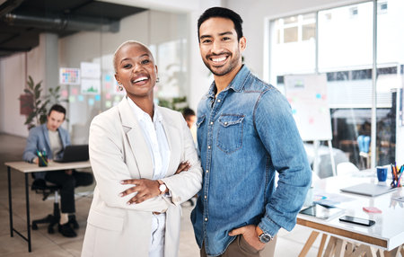 Business people, portrait and happy laughing in office for leadership, motivation and partnership. Face, diversity and design team collaboration with smile, teamwork and startup, mission or goalの写真素材