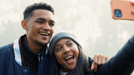 Selfie, love and a couple hiking in nature together for adventure, fun or to explore the wilderness. Photograph, travel and young people bonding while posing for a profile picture on social mediaの写真素材