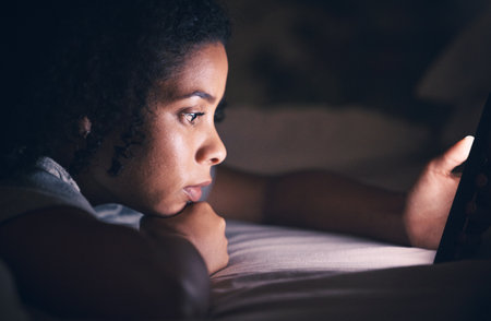Relax, insomnia and phone with woman in bedroom for social media app, night and networking. Communication, contact and internet with female person in bed at home for mobile, online and technologyの写真素材