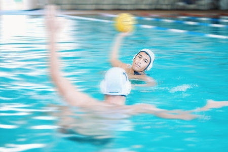 Water polo, shooting ball and people in swimming pool training, exercise and fitness game or sports event. Professional swimmer, man or team in competition, athlete challenge and speed blur or splashの写真素材