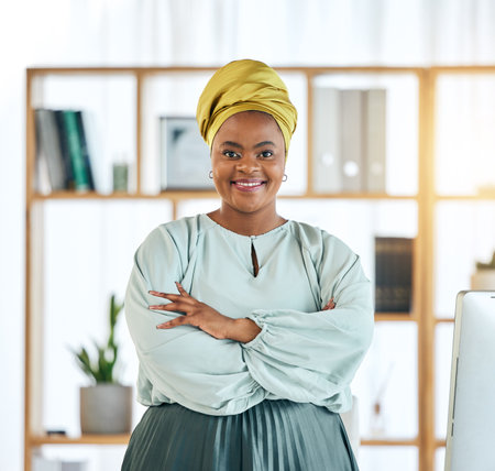 Black woman, business and arms crossed, smile in portrait and professional mindset with attorney at law firm. Female lawyer, career and legal employee with pride, expert and confidence in workplaceの写真素材