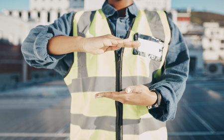 Hands, construction and engineer on a roof for solar energy, building electric plant or electricity...
