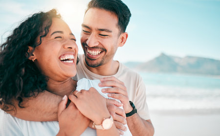 Love, happy and travel with couple on beach for lens flare, summer and vacation together. Peace, smile and relax with man and woman hugging on date for seaside holiday, care and mockup spaceの写真素材