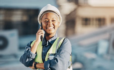 Phone call, construction worker and black woman conversation, smile or talk about roof inspection, advice or chat. Cellphone communication, builder or female engineer happy about rooftop architectureの写真素材