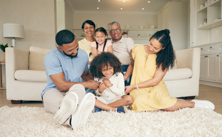 Happy, family and home with fun and tickle with mother, grandparents and children together. Parent relax, dad love and support with kids on a lounge sofa in a house with a smile in a living roomの写真素材
