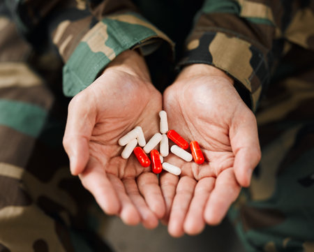 Soldier, hands and drugs from psychologist in therapy or person healing mental health with...