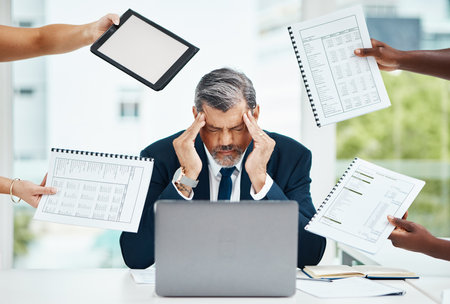 Headache, chaos and business man or manager stress for documents, tablet crisis and accounting problem. People hands, taxes and laptop of tired CEO for multitask, digital mockup and brain fog or painの写真素材