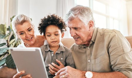 Family, grandparents and child on tablet in home e learning, online education and watch or streaming...