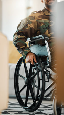Military, city and a man from the army in a wheelchair, war injury or rehabilitation. Hands, support and a person, soldier or hero with a disability as a veteran in mobility recovery in the streetの写真素材