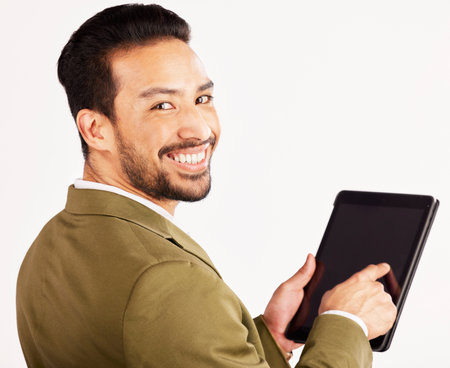 Portrait, business man and tablet mockup on screen in studio, white background or search stock market trading information. Face of happy asian trader, digital technology or internet space of app dataの写真素材