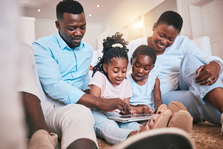 Relax, happy and tablet with black family in living room for streaming, games and elearning app. Digital, technology and internet with parents and children at home for movies, education and networkの写真素材