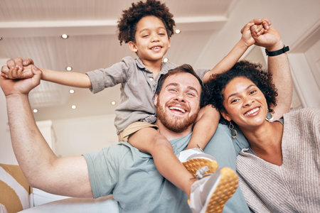 Mom, dad and boy on shoulders, piggyback and portrait in home with smile, holding hands and...