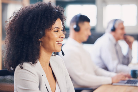 Happy, service and black woman in a call center for consulting, help and communication. Contact, talking and African customer support employee smiling for sales, advice and speaking for telemarketingの写真素材