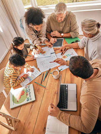 Family home, kids and homework with learning, grandparents and parents with tech in top view. Mother, father and children with laptop, tablet and paperwork in busy house with help, reading or studyの写真素材