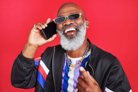 Staying connected is important these days. Studio shot of a retro dressed man talking on the...