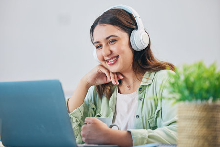 Laptop, education and headphones with woman in home office for elearning, study and blog. Digital,...