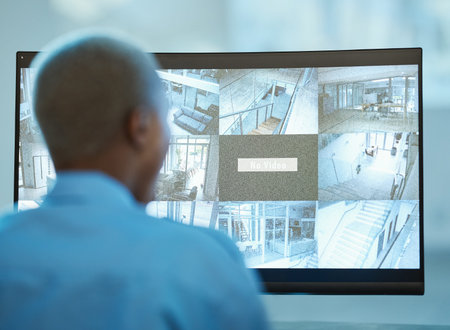 Security guard, safety and person in control room with computer screen for surveillance. Behind a...