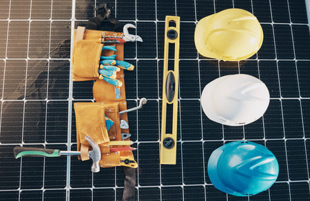 Solar panel, tools and renewable energy isolated for maintenance and construction work. Above view,...