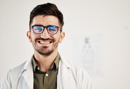 Eye exam, smile and portrait of man optometrist with confidence, glasses and friendly service in consultation office. Ophthalmology, face and happy male eye expert proud of vision testing careerの写真素材