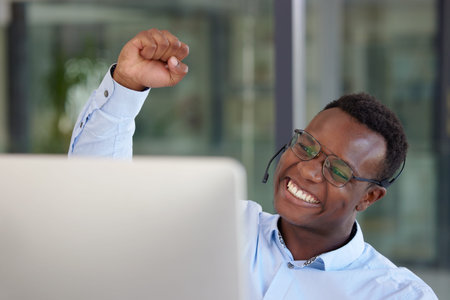 Winner, computer and call center with a black man cheering as a consultant in his customer service...