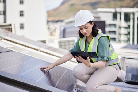 Solar panel, engineering ot woman with a tablet for planning, renewable energy or research. Connection, technology or photovoltaic maintenance with engineer for inspection, employee or sustainabilityの写真素材