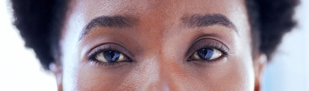 Banner, closeup eyes and portrait of black woman with makeup, serious expression or clean eyebrow. Skincare, microblading and an African girl or model with cosmetics, eyeliner or looking with beautyの写真素材