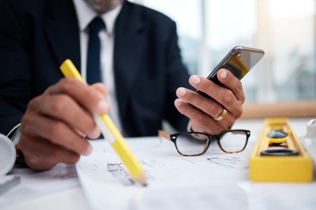 Phone, hands and pencil of architect man in an office with a blueprint, drawing or floor plan...