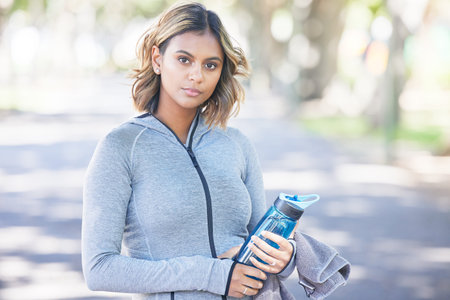 Portrait, fitness and woman outdoor, exercise and water bottle with wellness, healthy and sports....