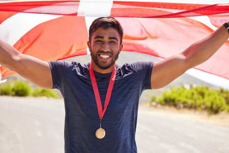Portrait, flag and man with a medal for winner, sports competition or winner in the street. Happy,...