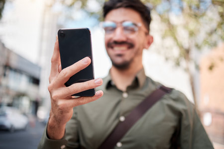 Phone, city and hand of business man online for chat, social media and network in town. Travel, professional and closeup of male worker on smartphone for communication, website and search on commuteの写真素材