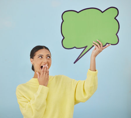 Social media woman, surprise or mockup speech bubble for wow opinion, studio news space or sales promotion voice. Notification poster, billboard deal or shocked announcement person on blue backgroundの写真素材