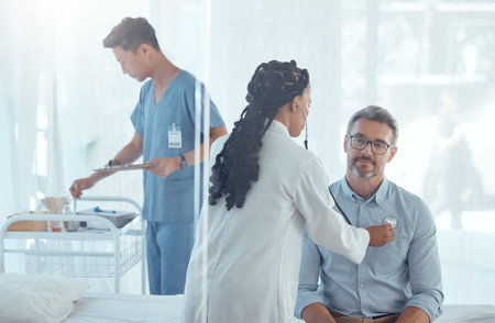 Doctor, stethoscope or hospital people with exam, test or healthcare assessment, medical consultation or services. Analysis, health and cardiology help, wellness and monitor heart, lungs or breathingの写真素材