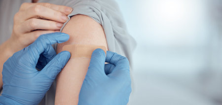 Doctor, arm and plaster on patient for vaccine in healthcare clinic, virus protection and wellness...