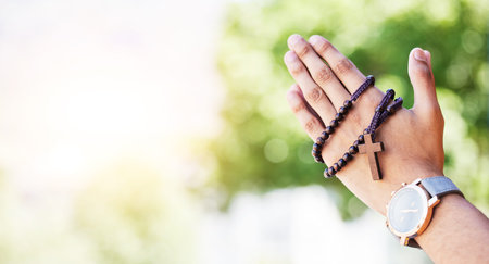 Faith, hands praying and rosary in garden with mockup, praise and religion with holy mindset....