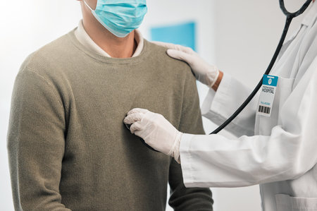 Doctor, closeup or woman with patient breathing for healthcare, nursing or wellness in clinic. Asthma exam, test or hands of medical worker checking heart beat with listening equipment in hospitalの写真素材