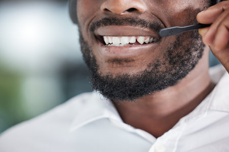 Mouth, man consulting for telemarketing in call center, customer service and advisory help of CRM questions. Closeup face of salesman, microphone and communication for telecom support, FAQ or contactの写真素材