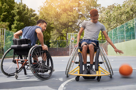 Sports competition, wheelchair basketball player and people playing competitive match, game or action challenge. Athlete player, dynamic mobility and active men with disability, training and exerciseの写真素材