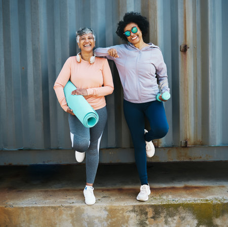 Senior, women and yoga with fitness, portrait of friends and health with wellness, happiness and cool outdoor. Happy female people with exercise, pilates and workout equipment with vitality and smileの写真素材