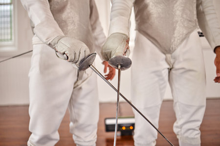 Fencing, gym or fight with a sword in training, exercise or fighting workout with a weapon in...
