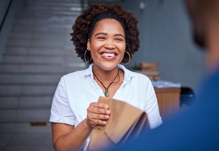Happy customer, delivery and a woman at a door with a paper bag from courier man at home. Face of person or client with package, parcel or fast food from online shopping, e-commerce or serviceの写真素材