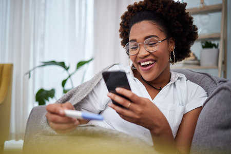 Pregnancy test, phone and woman share results on social media, internet or online happy for a baby...