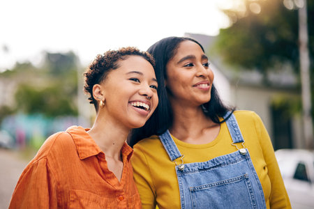Happy, smile and girl friends in park with laugh and funny joke with bonding and gossip outdoor. Gen z, young people and relax with female friendship, freedom and holiday with joy on student vacationの写真素材