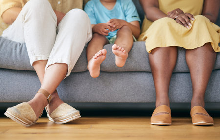 Legs, gay couple and a family on a home sofa for security, quality time and love. Feet of women or...