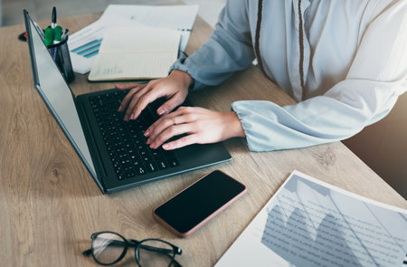 Laptop keyboard, hands and business woman typing financial budget report, accounting feedback or administration. Finance review, closeup professional person or accountant working on spreadsheet dataの写真素材