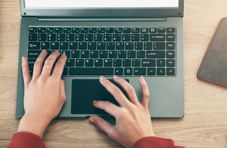 Laptop keyboard, hands and person typing report, online feedback or customer experience review. Research, closeup top view and woman working on social media blog post, copywriting or projectの写真素材